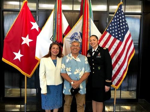 Kelly Guerra in her uniform with her parents