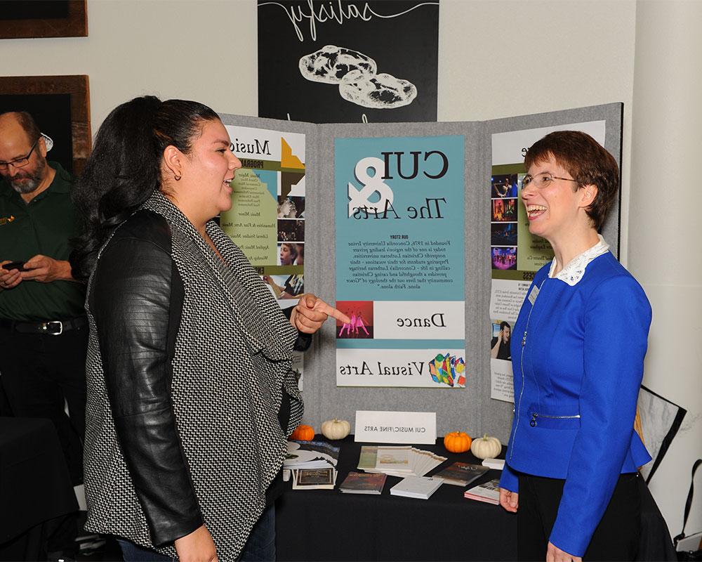 Two girls talking about a presentation